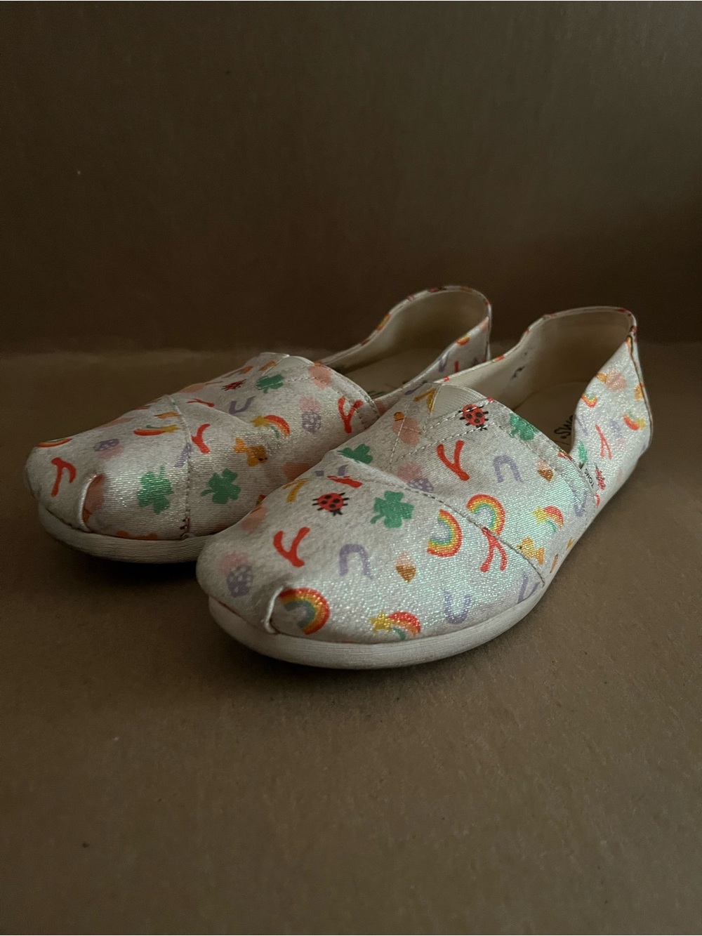 Toms White Glittering Slip-On Flats with Good Luck Print